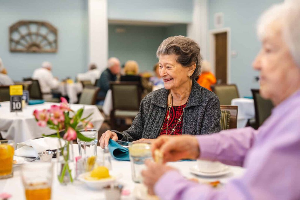 Senior woman seated at dining table